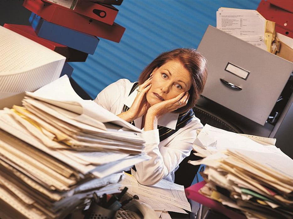overwhelmed woman in office