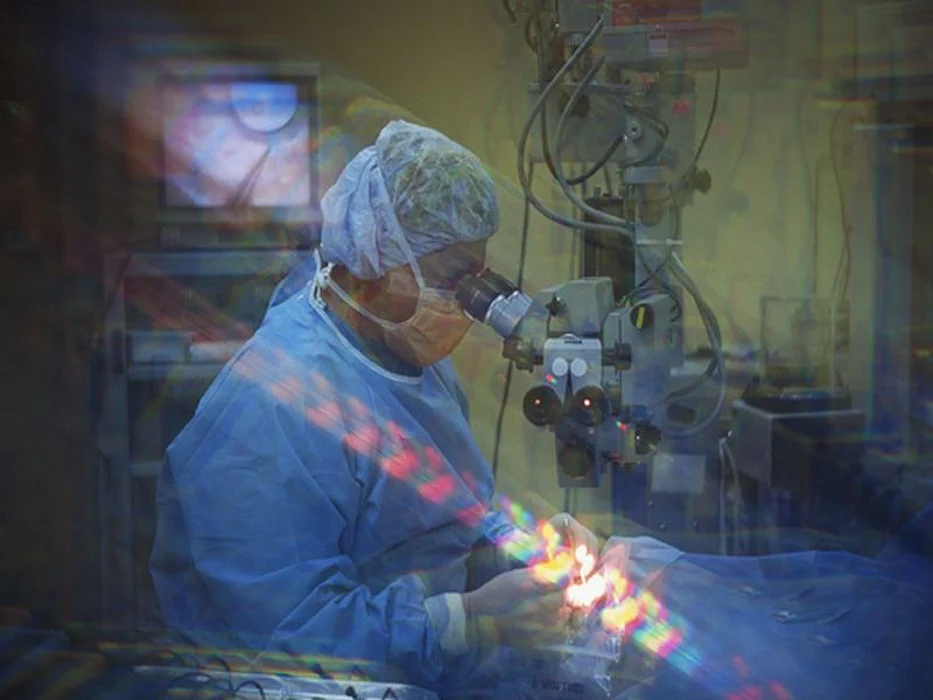 man looking through the microscope