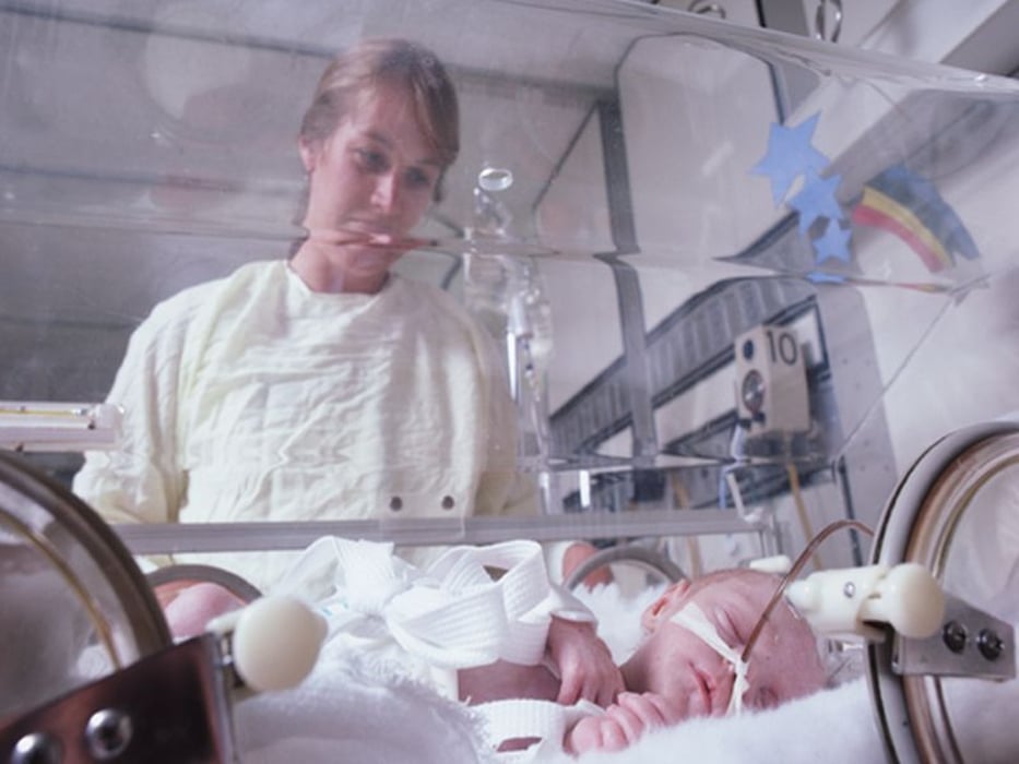 newborn in incubator
