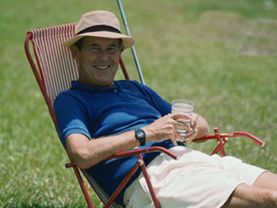 man relaxing on the lawn chair