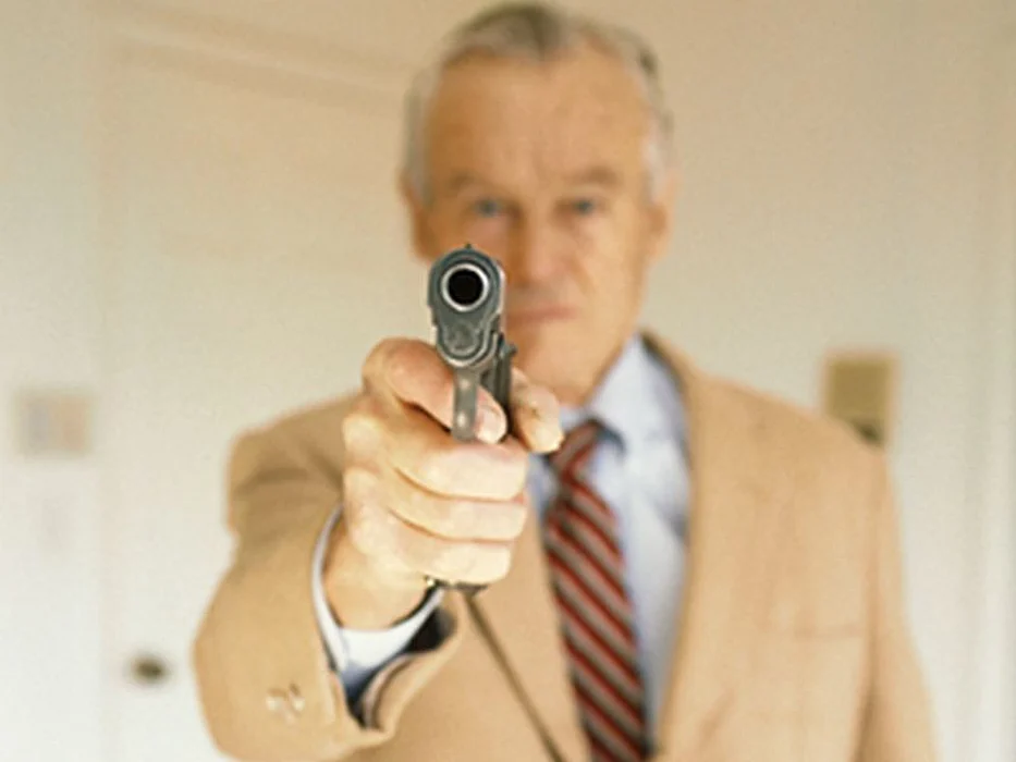 man aiming gun
