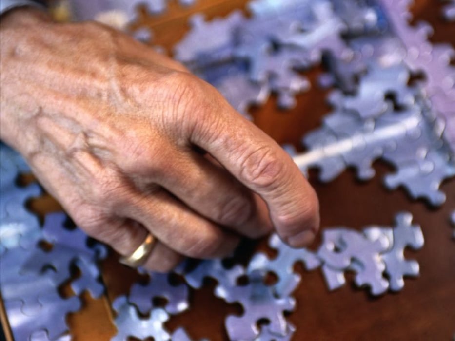 Elderly doing puzzle