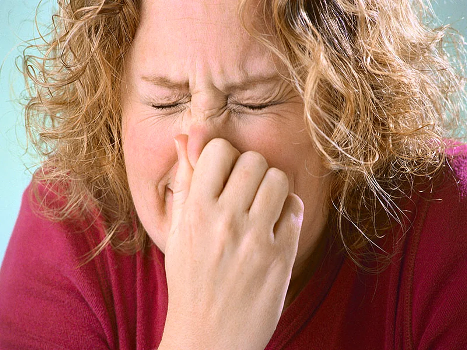 woman sneezing