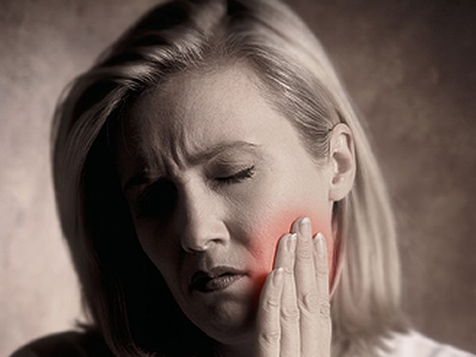 woman with cheek pain