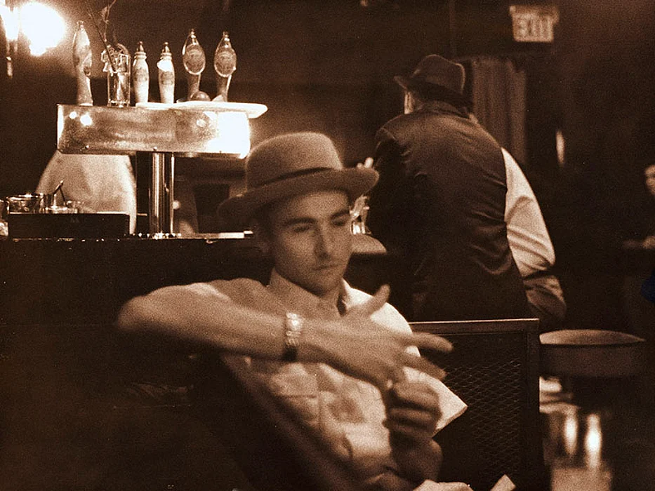 man sitting at the bar