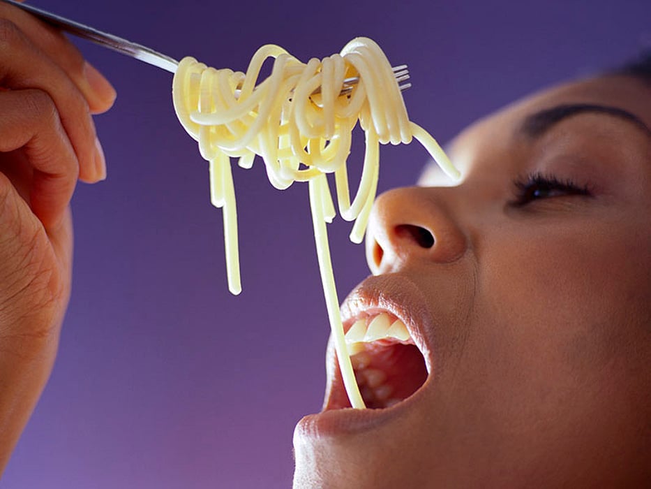 woman eating pasta