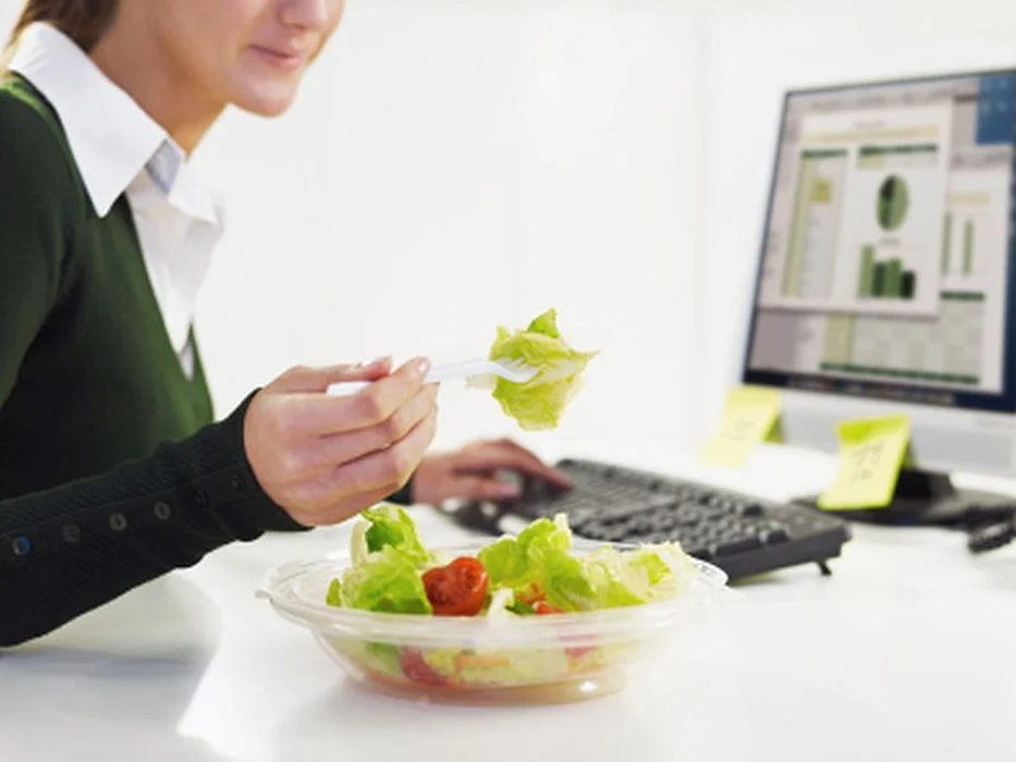 woman eating salad