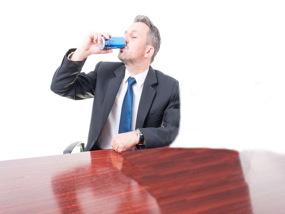 man drinking energy drink