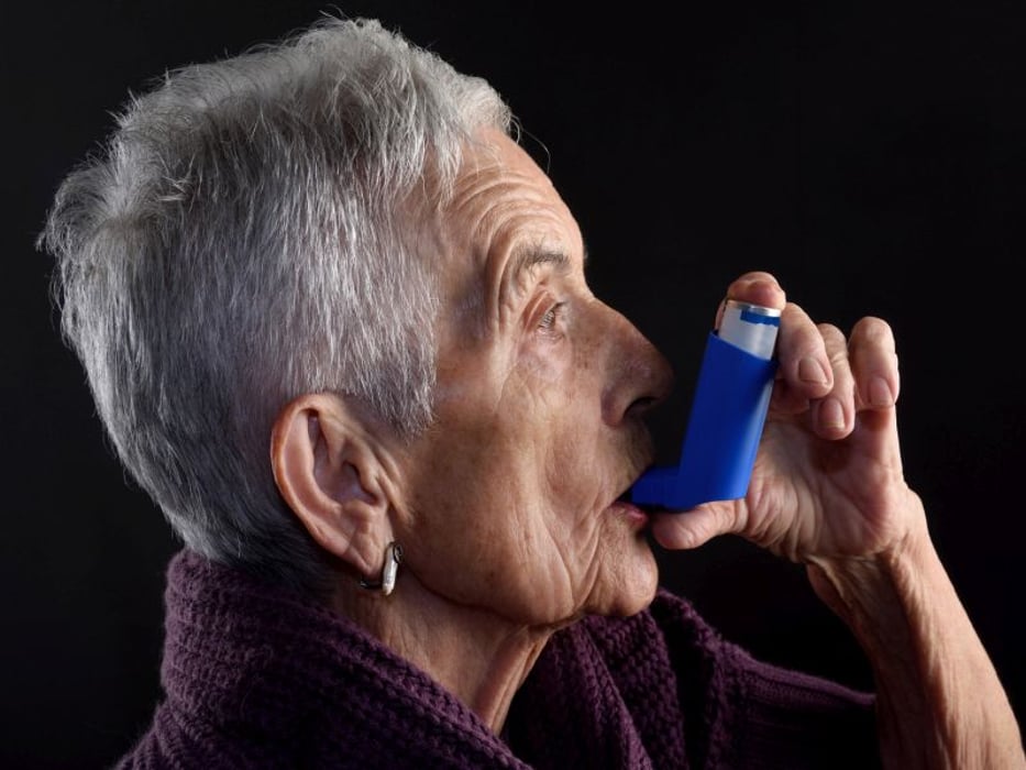 elderly woman with inhaler