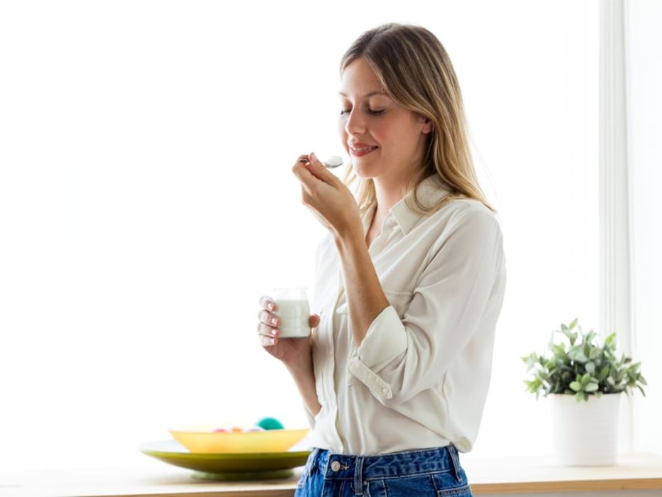 woman eating yogurt