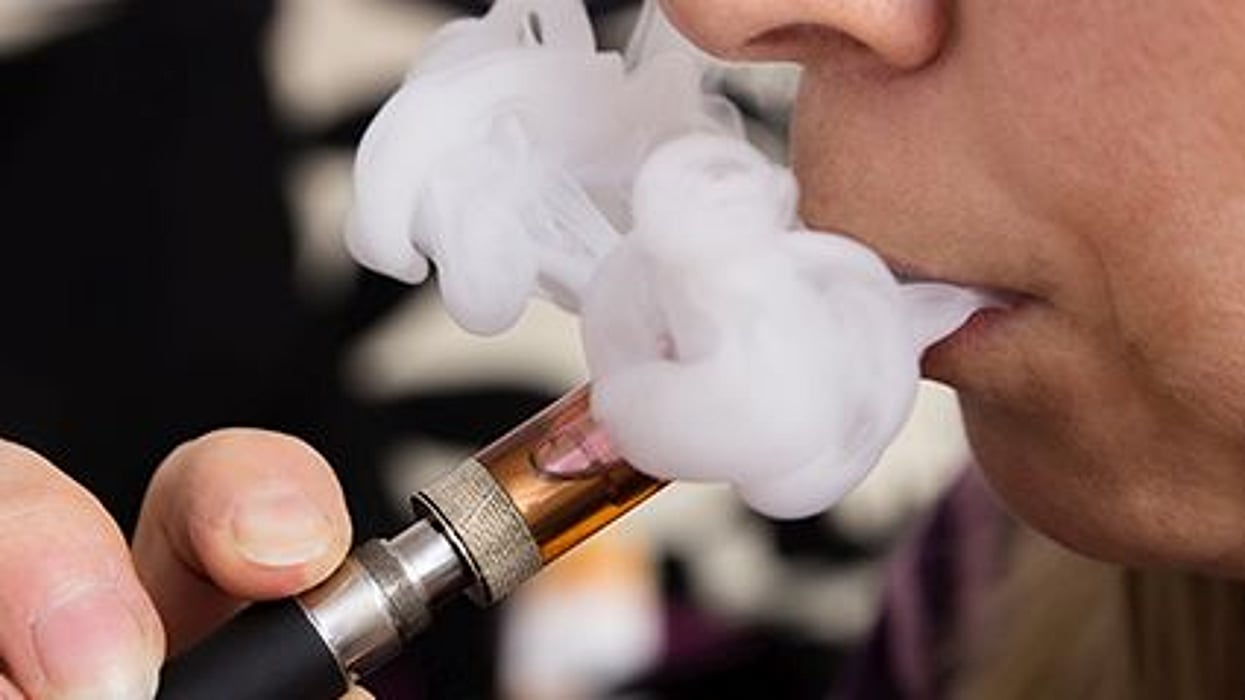 a person smoking e-cigarette