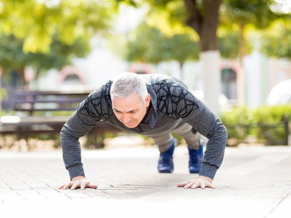 middle-aged man doing pushup