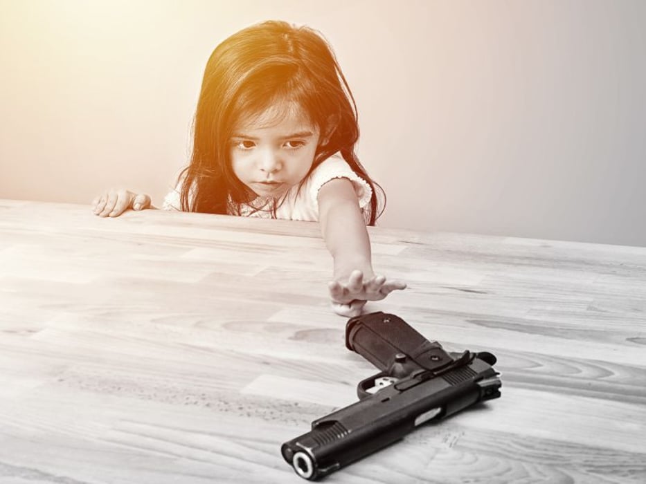 child and handgun