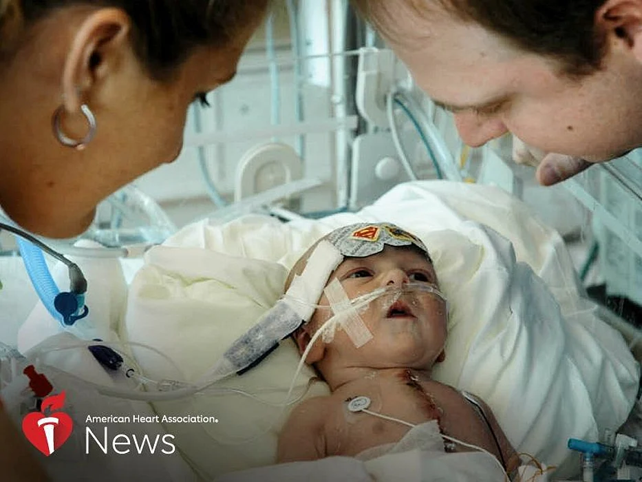 Two-week-old Skylar Myers with his mom Rikki and dad Greg