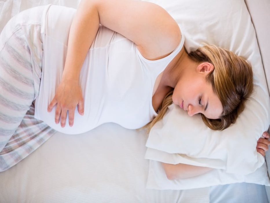pregnant woman sleeping on side