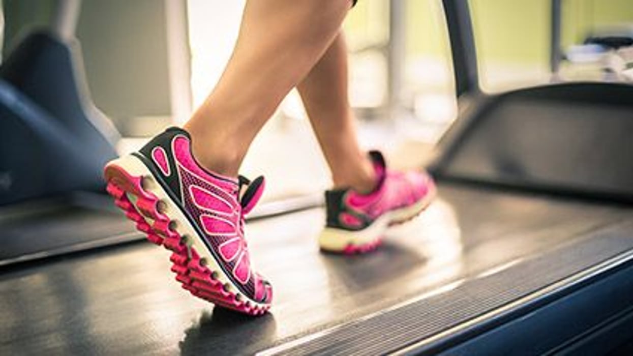 a person's feet on a treadmill