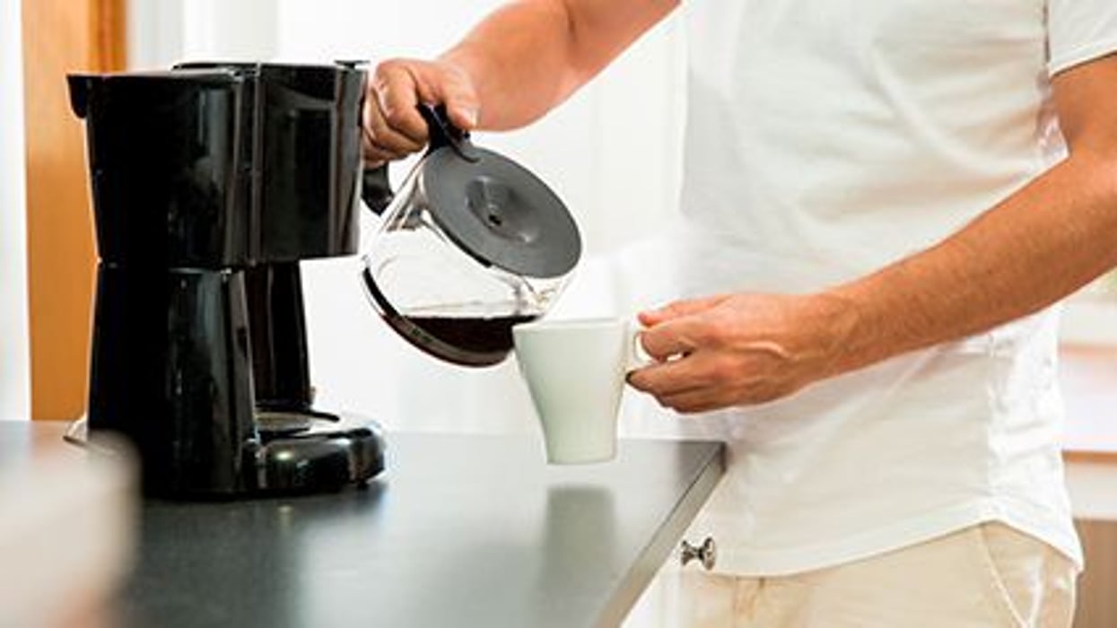 a person making coffee
