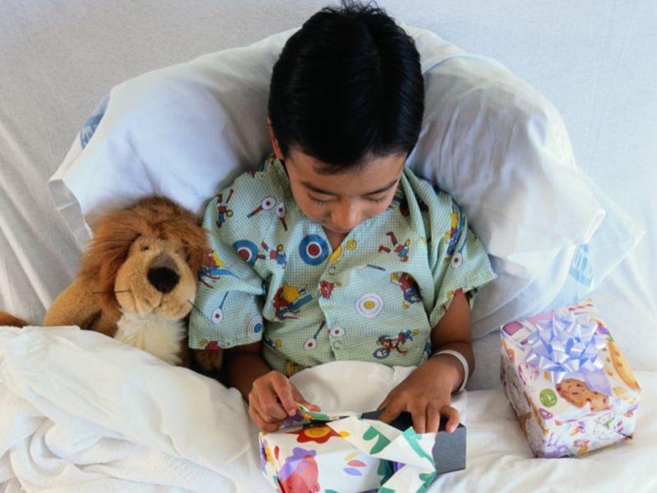 a boy on a hospital bed