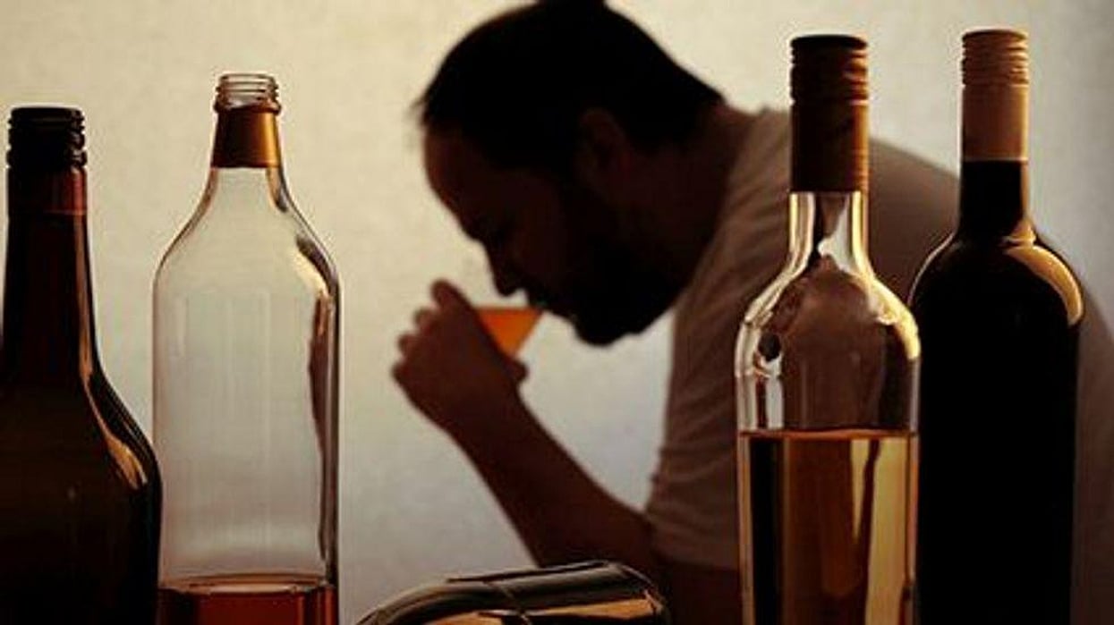 a man drinking alcohol