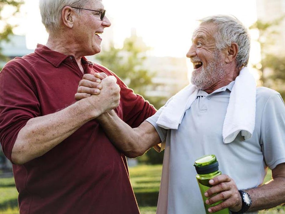 two older man shakig hands after exercise