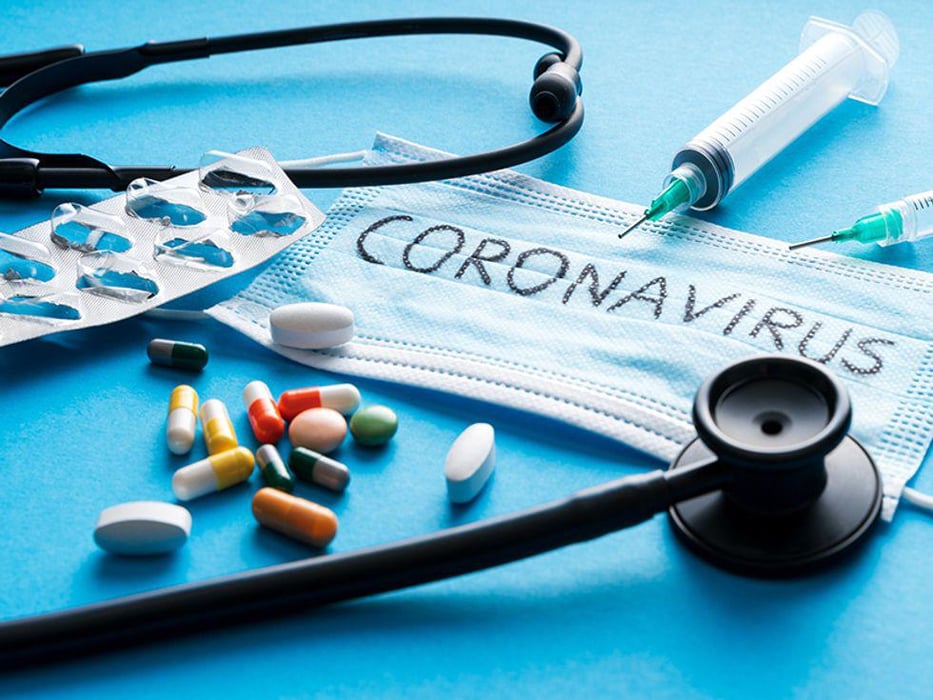 protective mask,pills, syringes, Stethoscope on blue background with coronavirus
