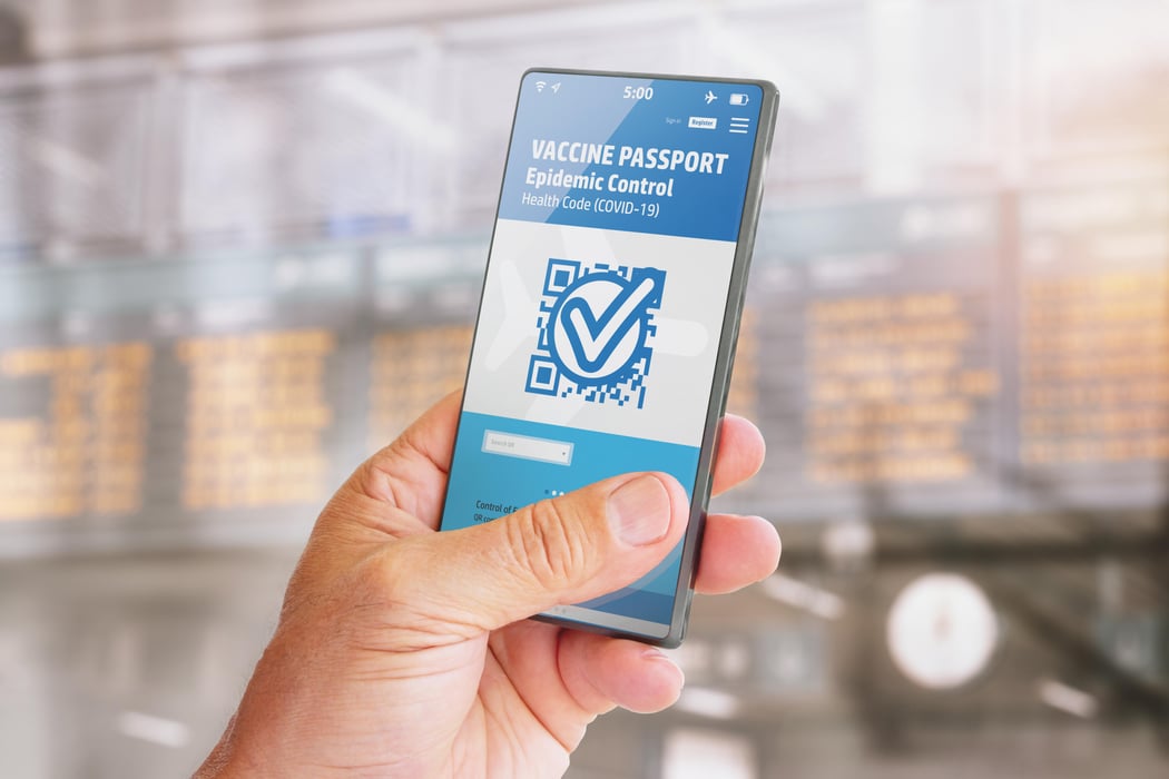 Smart phone with vaccine passport on screen for traveling