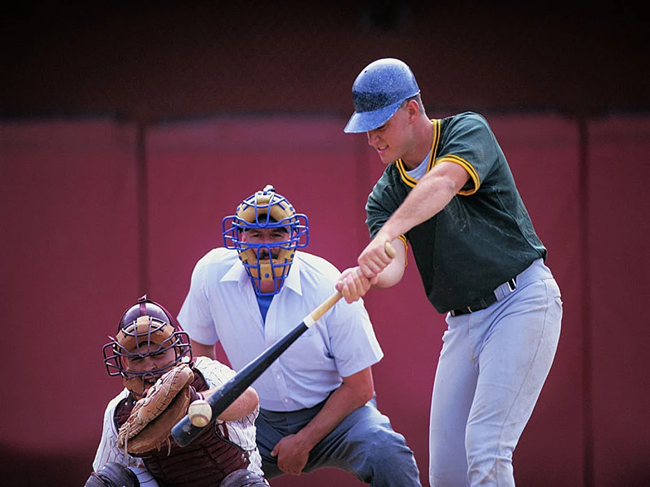 baseball batter swinging at a pitch
