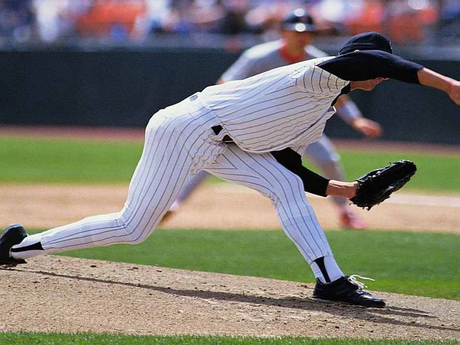 baseball pitcher throwing a pitch
