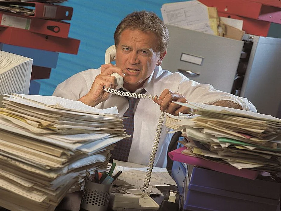man on office phone