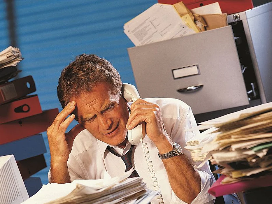 man on office phone