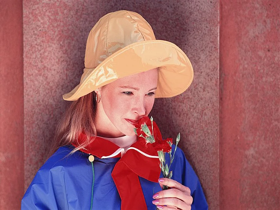 woman smelling flower