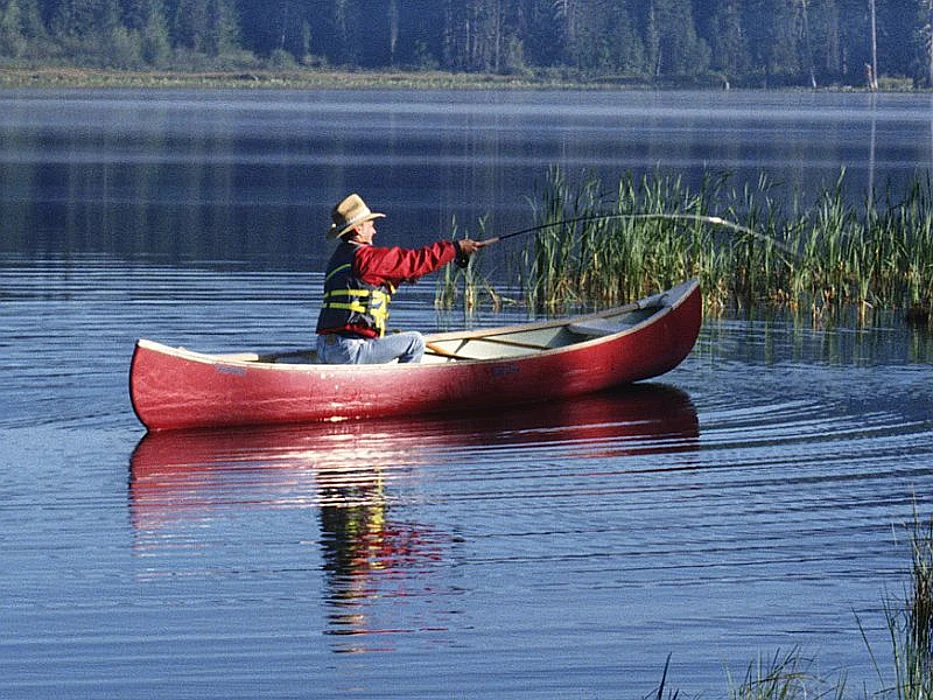 fisherman in canoe