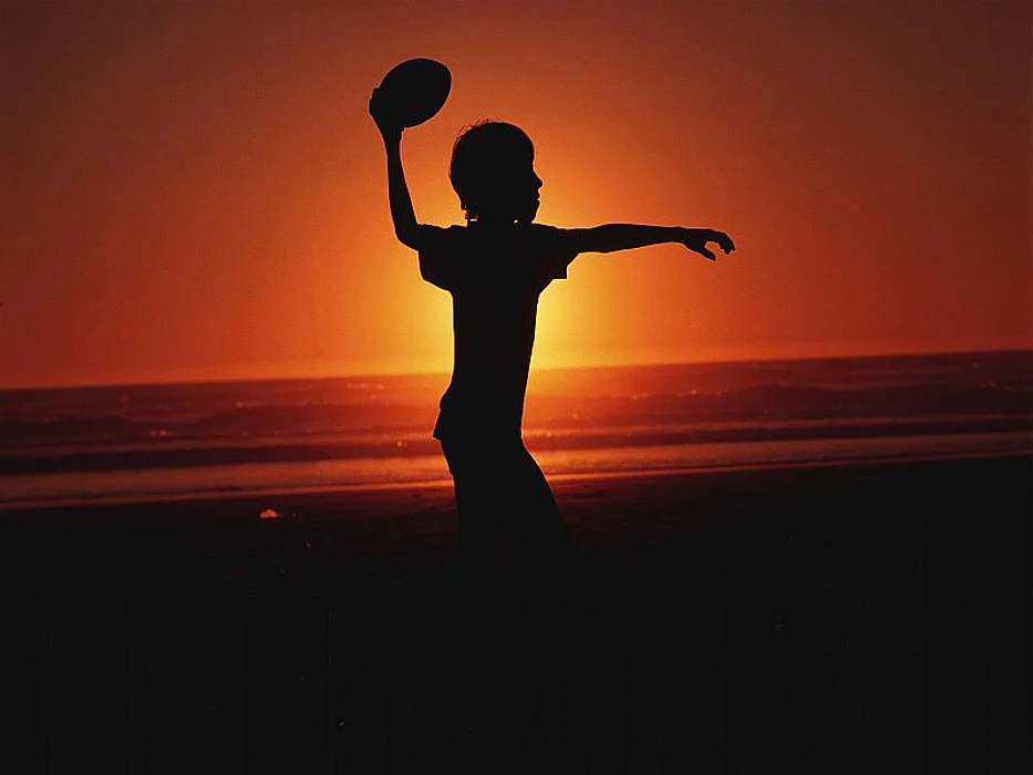 child playing football