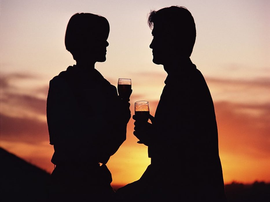 couple toast with glasses of wine
