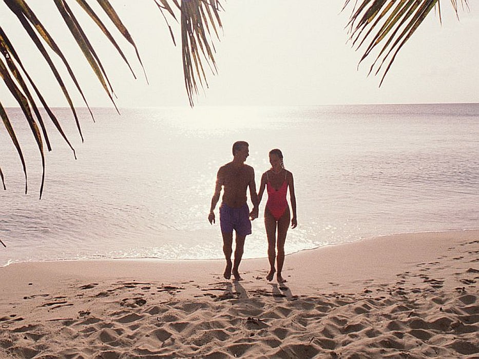 couple on the beach holding hands