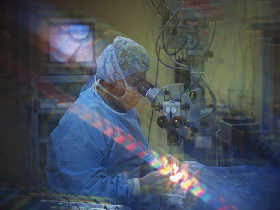 man looking through the microscope
