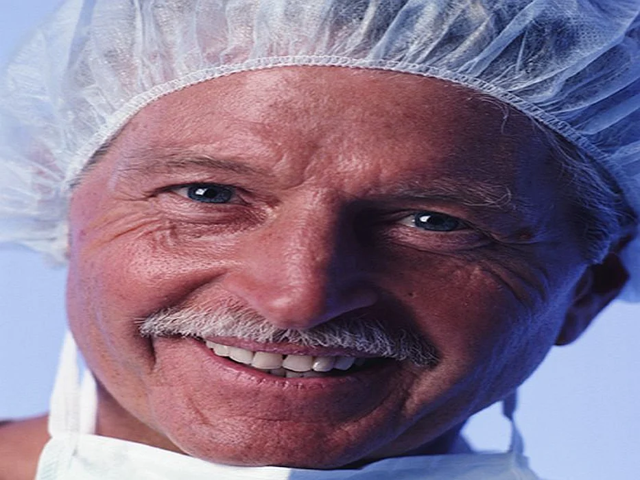 physician doctor with surgical mask and cap