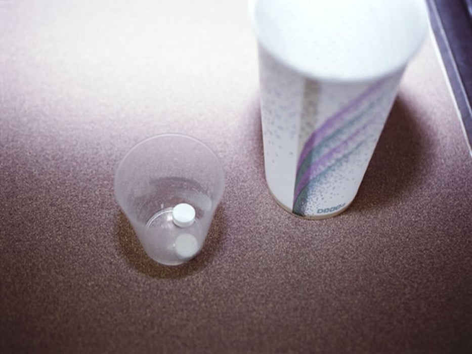 pill with cup of water