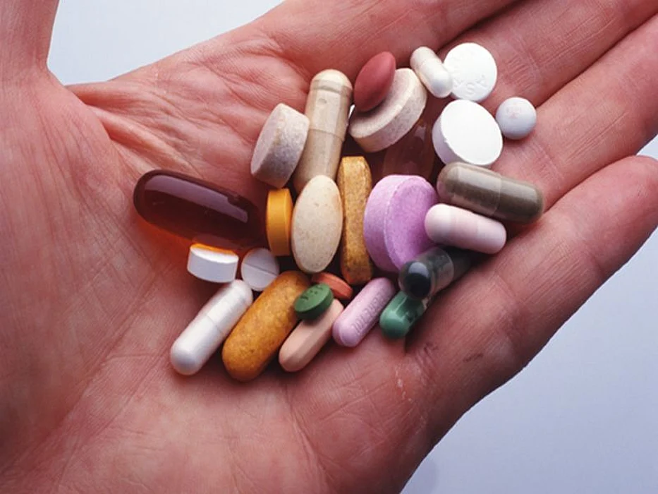 pills on a palm of a hand