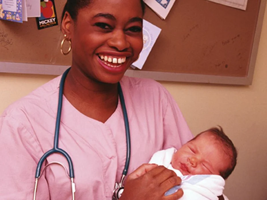 nurse with newborn