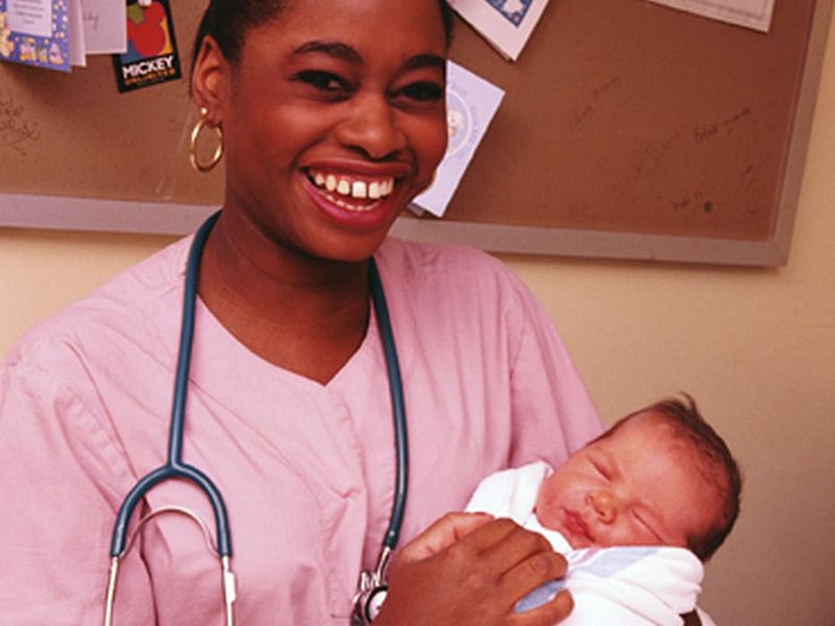 nurse with newborn