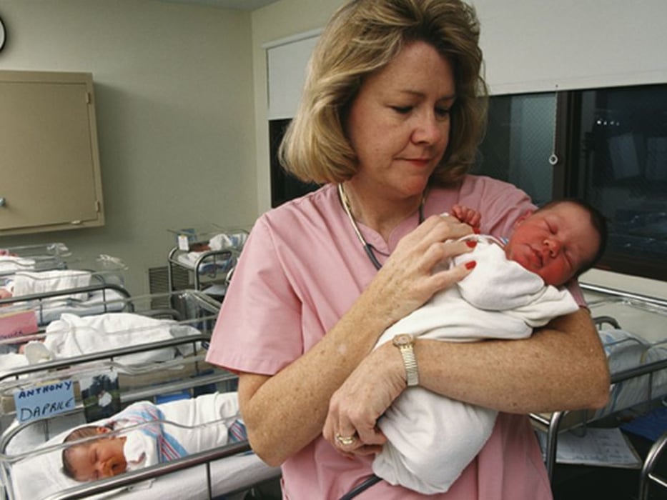 nurse with newborn