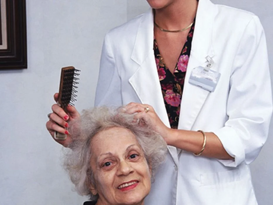 elderly woman getting hair done