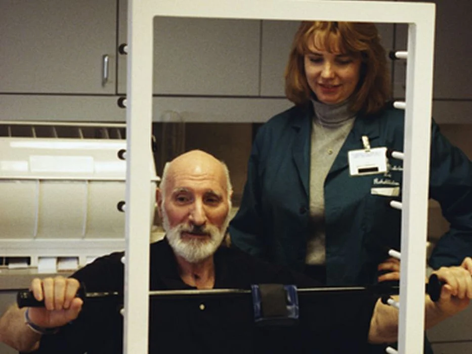 elderly man getting physical therapy