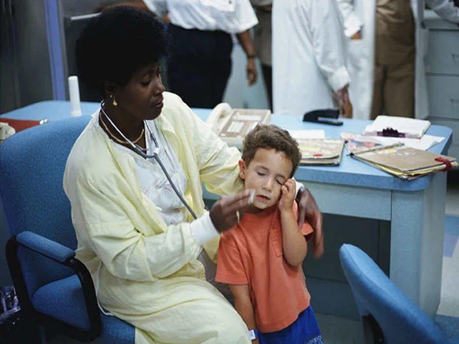 a boy crying because of injury