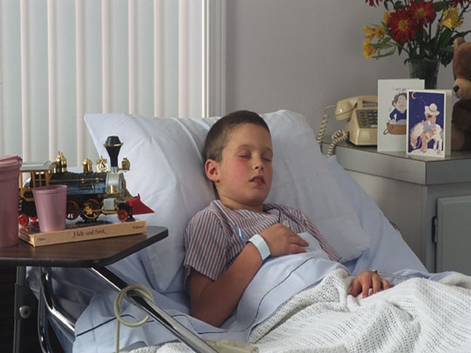 a boy on a hospital bed