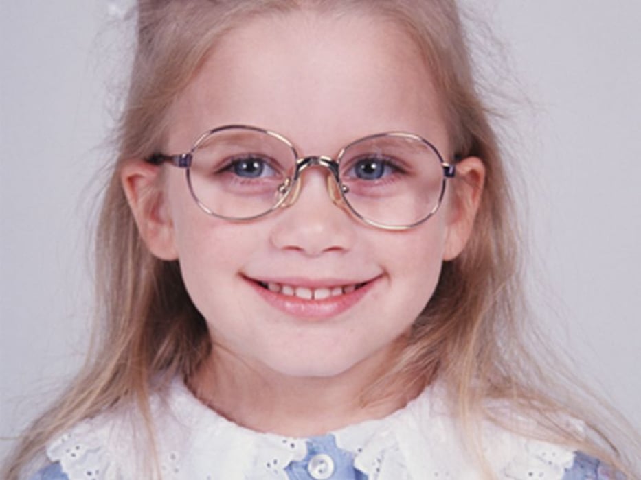 girl smiling wearing glasses