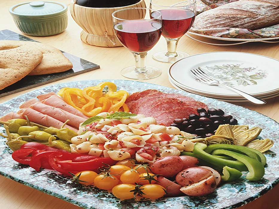 cold cuts with pasta and veggies on a plate