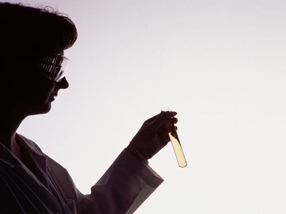 woman with a sample of liquid