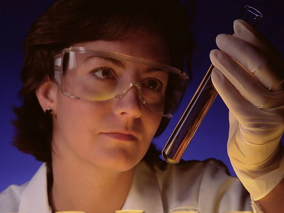 woman looking at the specimen